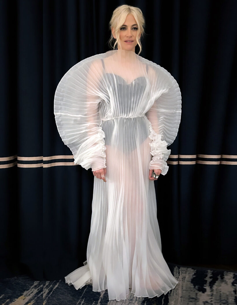 K music celebrity Pixie Lott at the Women’s Football Awards, wearing a striking pleated white gown with voluminous sleeves and collar, accessorized with Floa Design sterling silver rings.