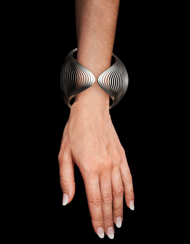 Contemporary silver cuff bracelet for women featuring a sculptural ribbed fluid design by Floa Design