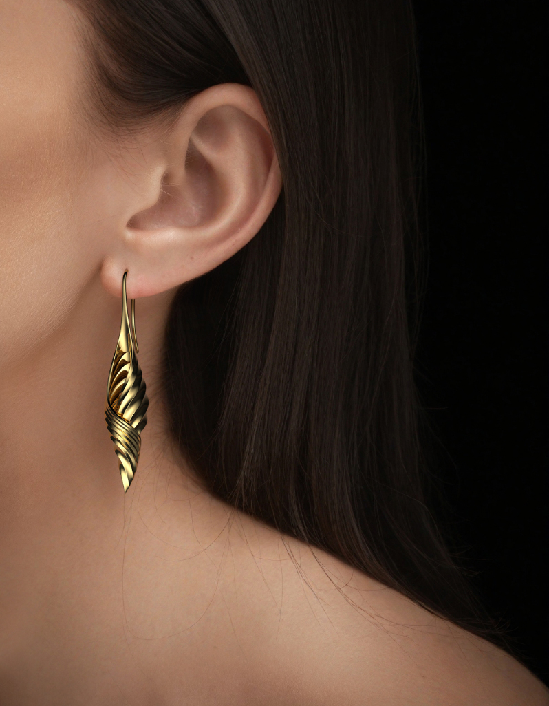 Contemporary gold drop earrings for women with a seamless long spiral shell design by Floa Design