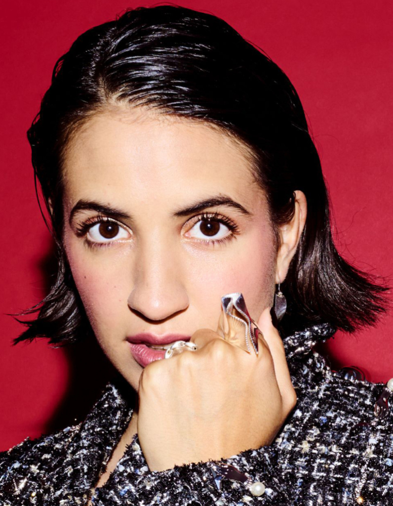 Spanish-American singer Victoria Canal wearing a luxury large chunky statement ring in silver by Floa Design styled with a tweed jacket for the NME cover shoot